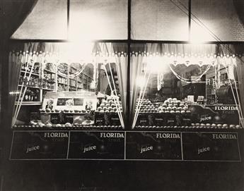 (ADVERTISING & STORE WINDOWS--FRUIT) A collection of 27 advertising and display photographs related to the Florida orange and citrus in